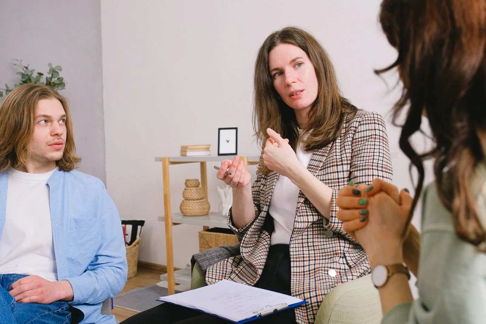 Therapist taking notes during a patient session
